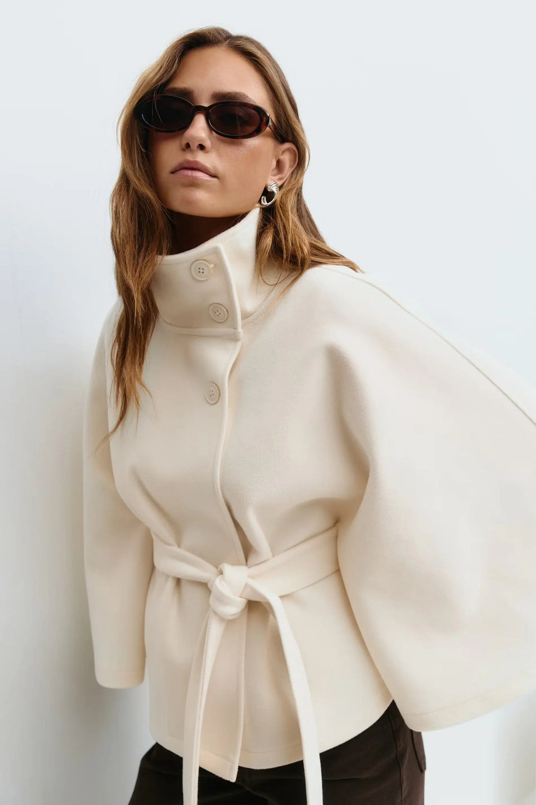 Elegant winter wool jacket for women with funnel neck batwing sleeve belted cape style in Beige