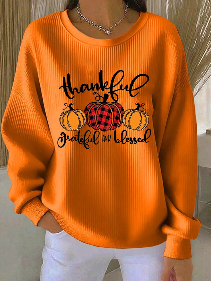 Women's ribbed crew neck winter sweater with pumpkin graphic in orange