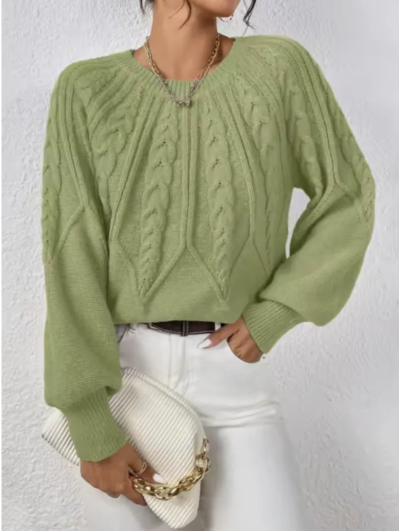 Women's crew neck winter cable knit sweater with varied pattern