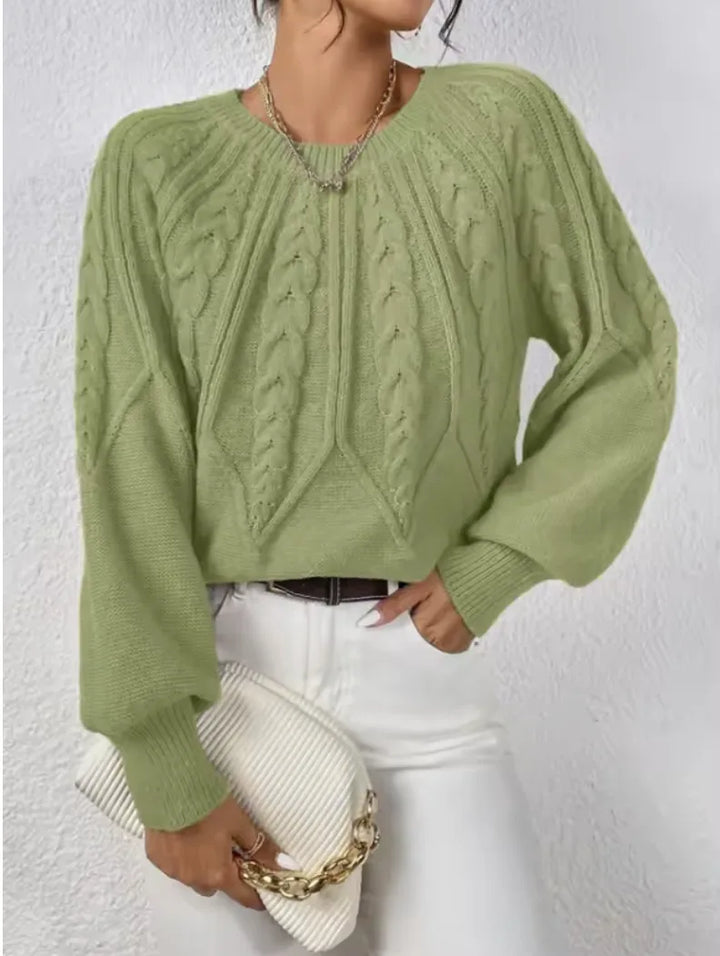 Women's crew neck winter cable knit sweater with varied pattern