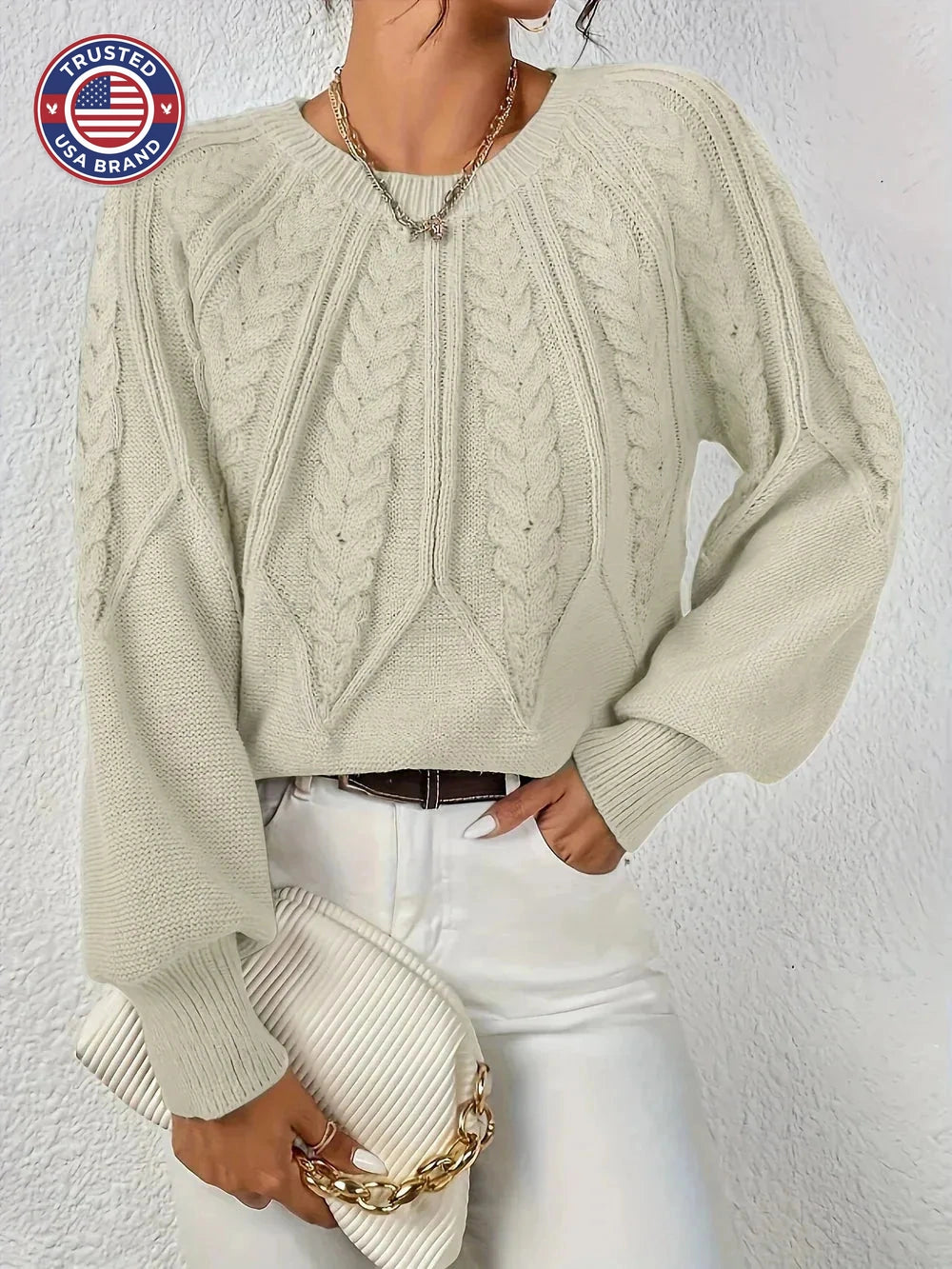 Women's crew neck winter cable knit sweater with varied pattern