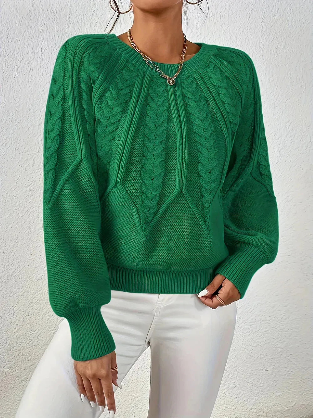 Women's crew neck winter cable knit sweater with varied pattern