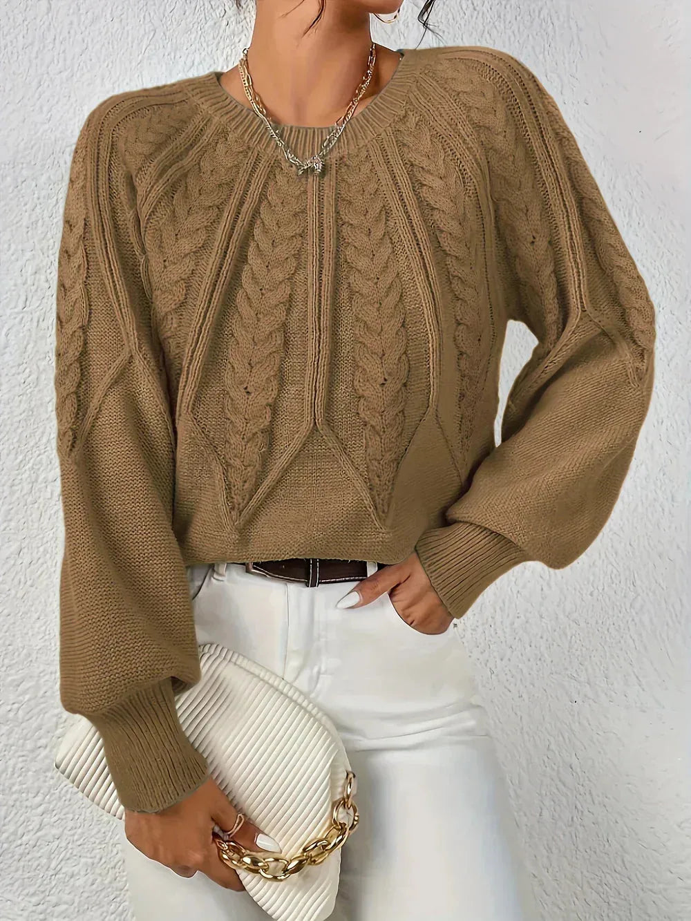 Women's crew neck winter cable knit sweater with varied pattern