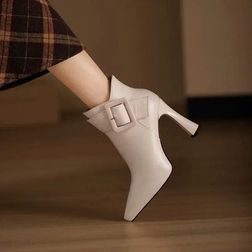 Women's faux leather side zip ankle winter boots with large buckle