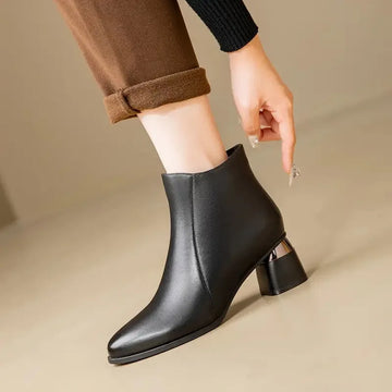 Women's faux leather side zip ankle winter boots with pointed toe and metallic heel
