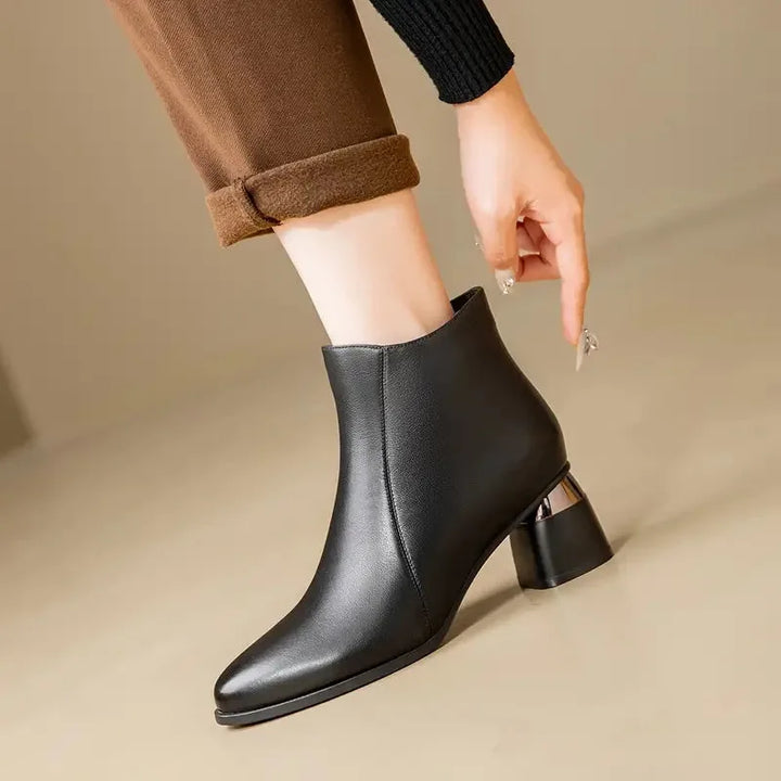 Women's faux leather side zip ankle winter boots with pointed toe and metallic heel