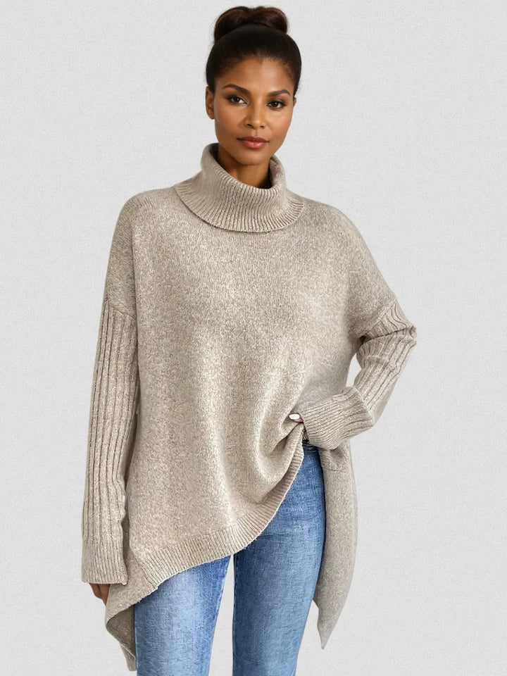 Women's knit winter roll neck sweater with asymmetrical hem
