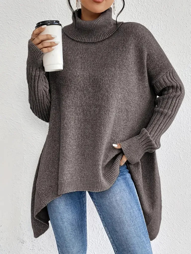 Women's knit winter roll neck sweater with asymmetrical hem