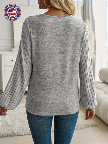 Women's knit v-neck winter sweater with ribbed balloon sleeves