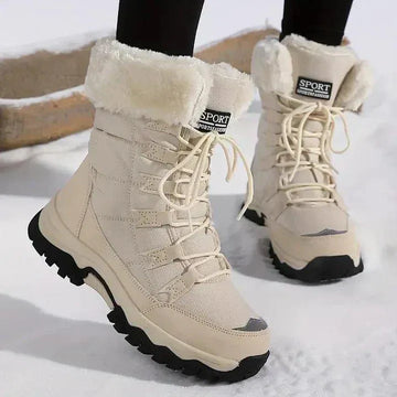 Women's quilted lace-up waterproof combat winter boots with faux fur trim