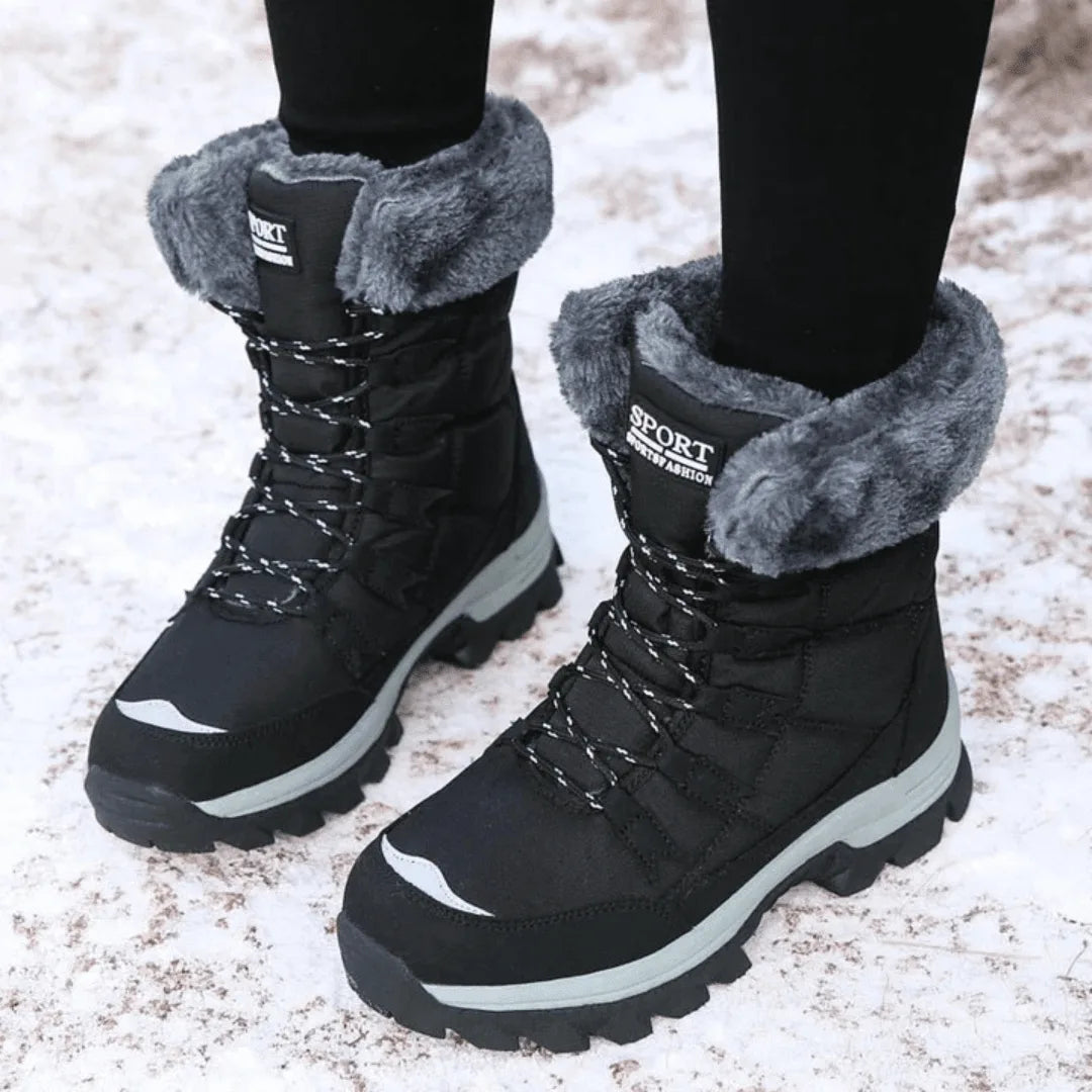 Women's quilted lace-up waterproof combat winter boots with faux fur trim