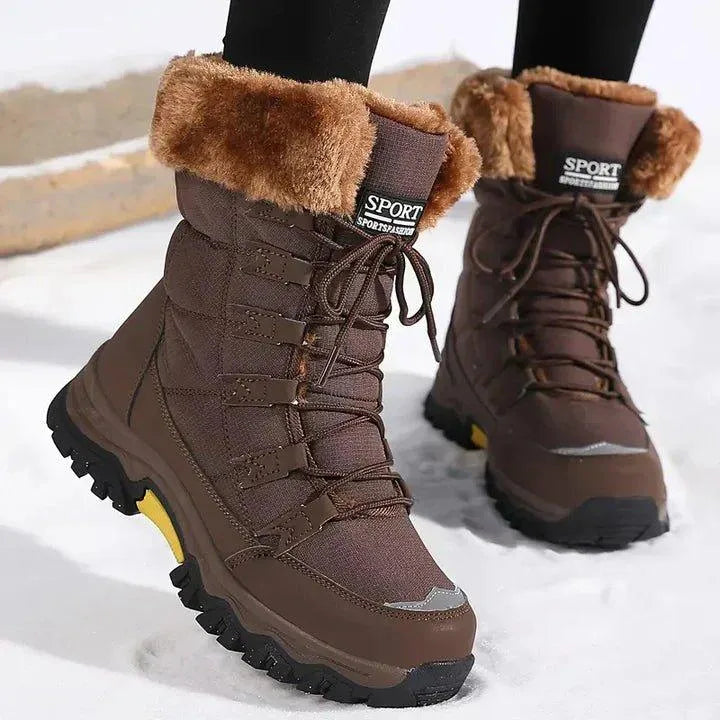 Women's quilted lace-up waterproof combat winter boots with faux fur trim