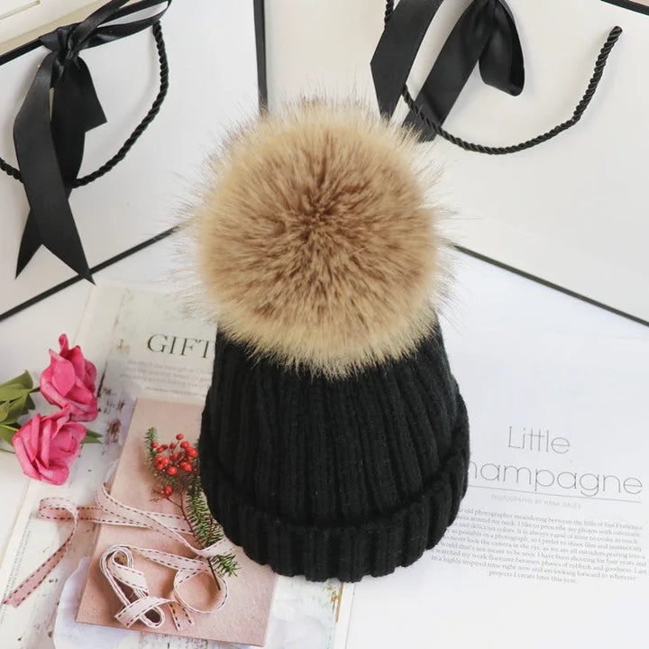 Women's ribbed winter top with detachable faux fur pom-pom