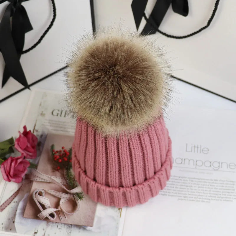 Women's ribbed winter top with detachable faux fur pom-pom