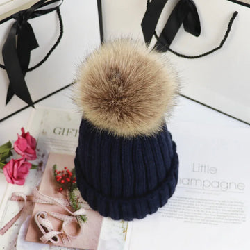 Women's ribbed winter top with detachable faux fur pom-pom