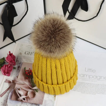Women's ribbed winter top with detachable faux fur pom-pom