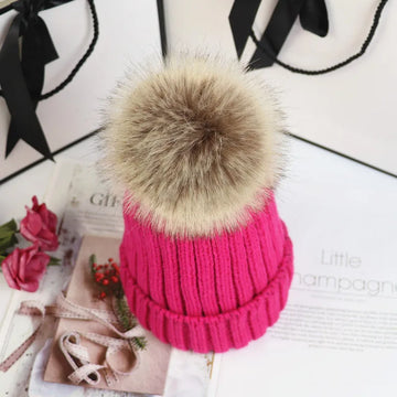 Women's ribbed winter top with detachable faux fur pom-pom