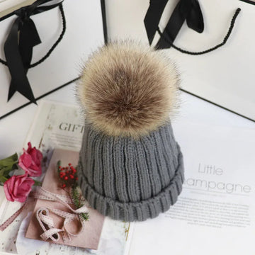 Women's ribbed winter top with detachable faux fur pom-pom