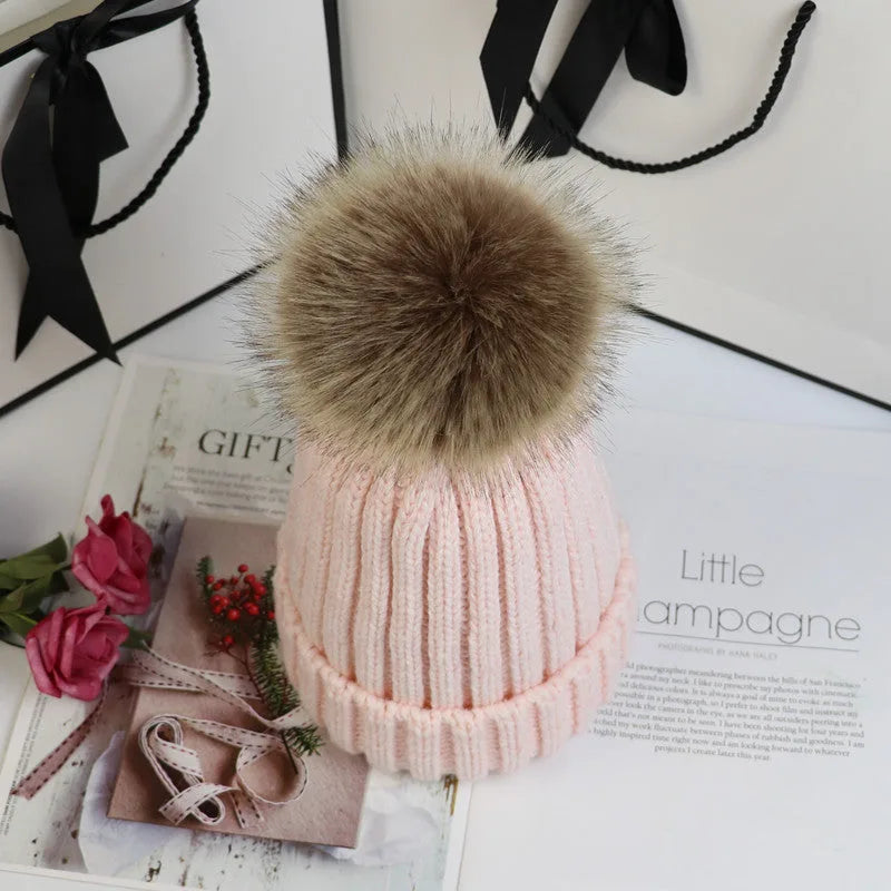 Women's ribbed winter top with detachable faux fur pom-pom