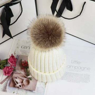 Women's ribbed winter top with detachable faux fur pom-pom