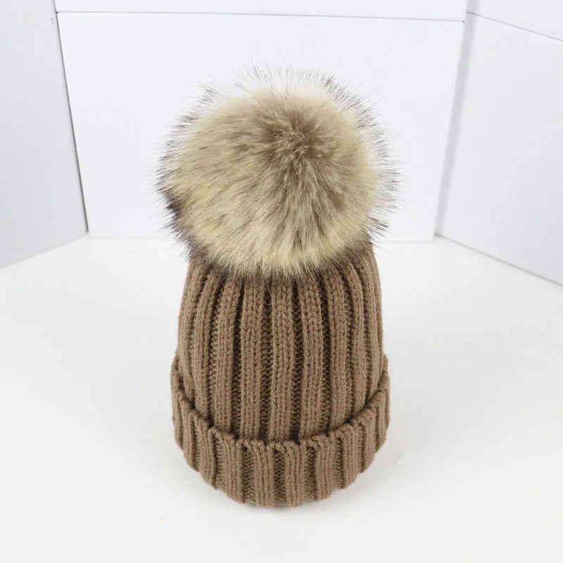 Women's ribbed winter top with detachable faux fur pom-pom
