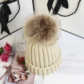 Women's ribbed winter top with detachable faux fur pom-pom