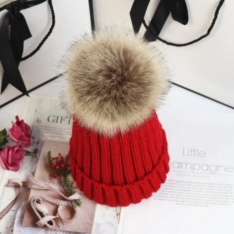 Women's ribbed winter top with detachable faux fur pom-pom