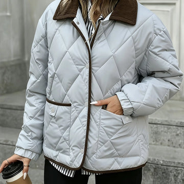 Women's quilted winter puffer jacket with snap button closure in Silvery Grey