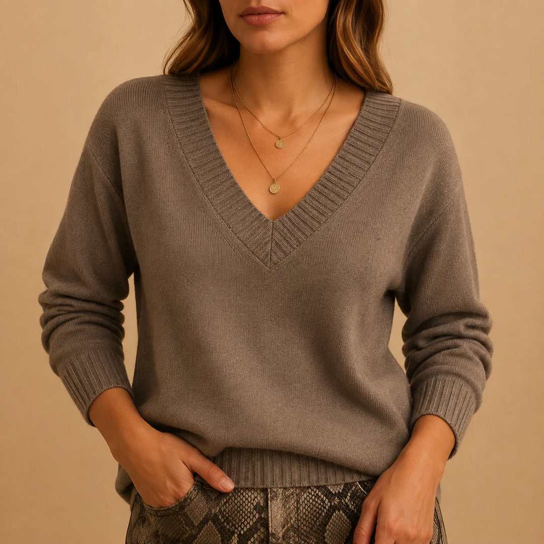Soft knit winter sweater with ribbed v-neckline and ribbed cuffs in Beige