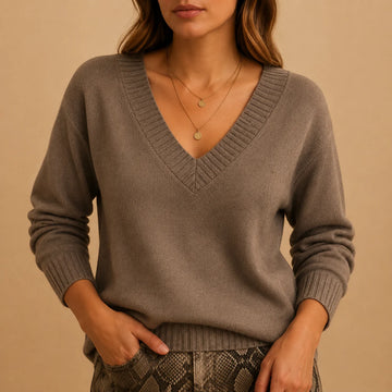 Soft knit winter sweater with ribbed v-neckline and ribbed cuffs in Beige