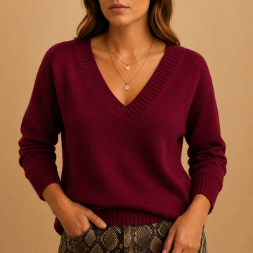 Soft knit winter sweater with ribbed v-neckline and ribbed cuffs in Berry Red