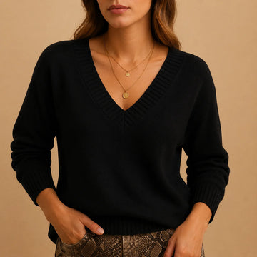 Soft knit winter sweater with ribbed v-neckline and ribbed cuffs in Black