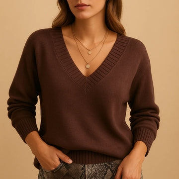 Soft knit winter sweater with ribbed v-neckline and ribbed cuffs in Brown