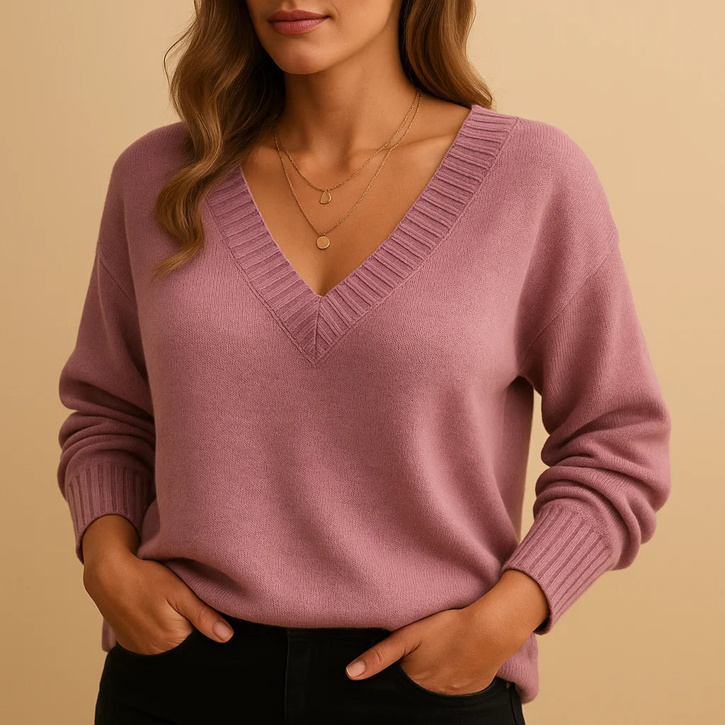 Soft knit winter sweater with ribbed v-neckline and ribbed cuffs in Pink
