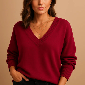 Soft knit winter sweater with ribbed v-neckline and ribbed cuffs in Red