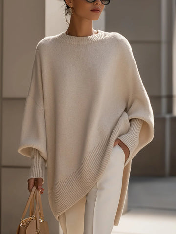 Women's knit crew neck winter sweater with asymmetrical hem