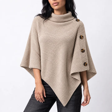 Women’s knitted turtleneck winter poncho with buttons and asymmetric hem in Beige