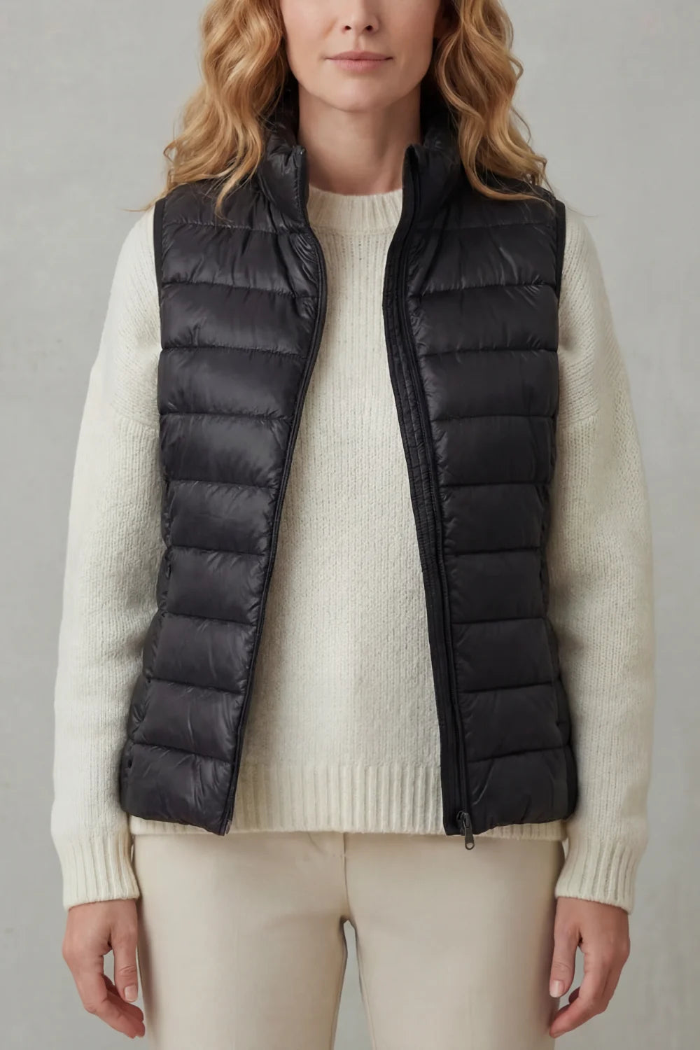 Women's puffer jacket style lightweight layering winter vest in Black