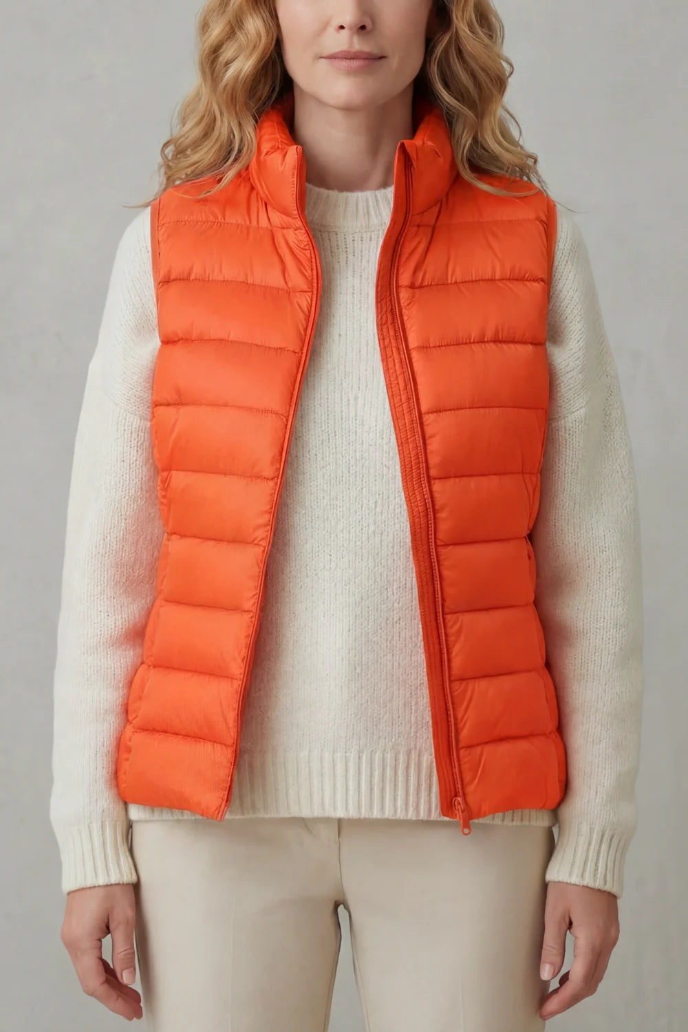Women's puffer jacket style lightweight layering winter vest in Orange
