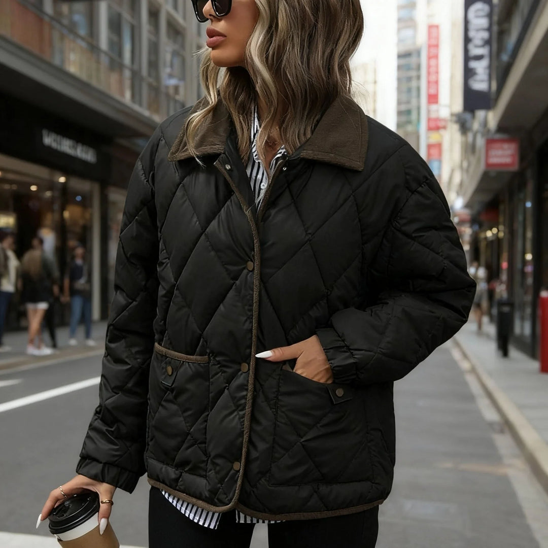 Women's quilted winter puffer jacket with snap button closure in Black