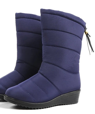 Women's quilted mid-calf winter snow boots with faux fur lining in Navy Blue